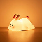 Bunny Night Lamp glowing warm on a bedside table
