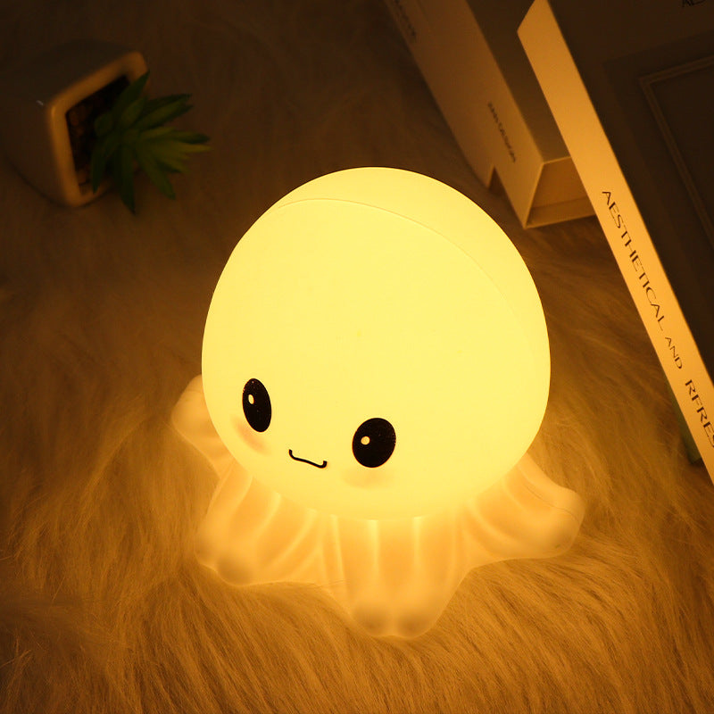 Jellyfish Night Lamp glowing warm in a bedroom