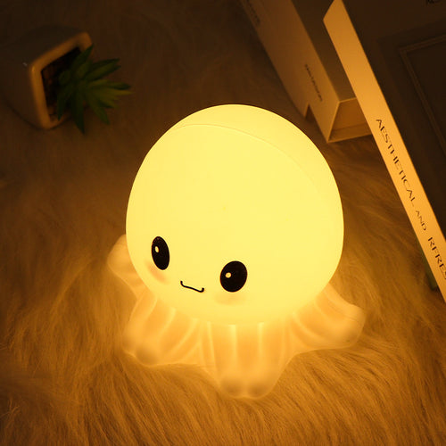 Jellyfish Night Lamp glowing warm in a bedroom